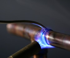 Plumber using a blowtorch